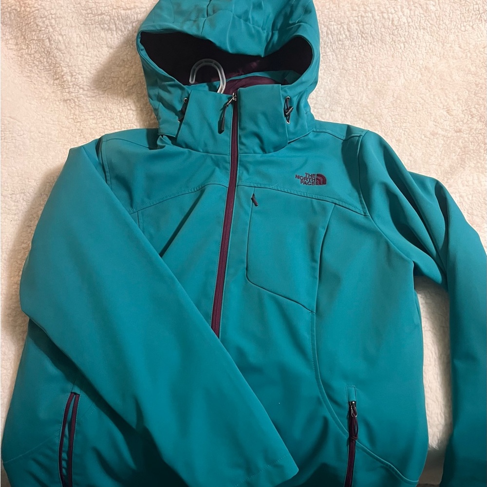 NWOT beautiful teal and purple North Face winter coat with detachable hood.